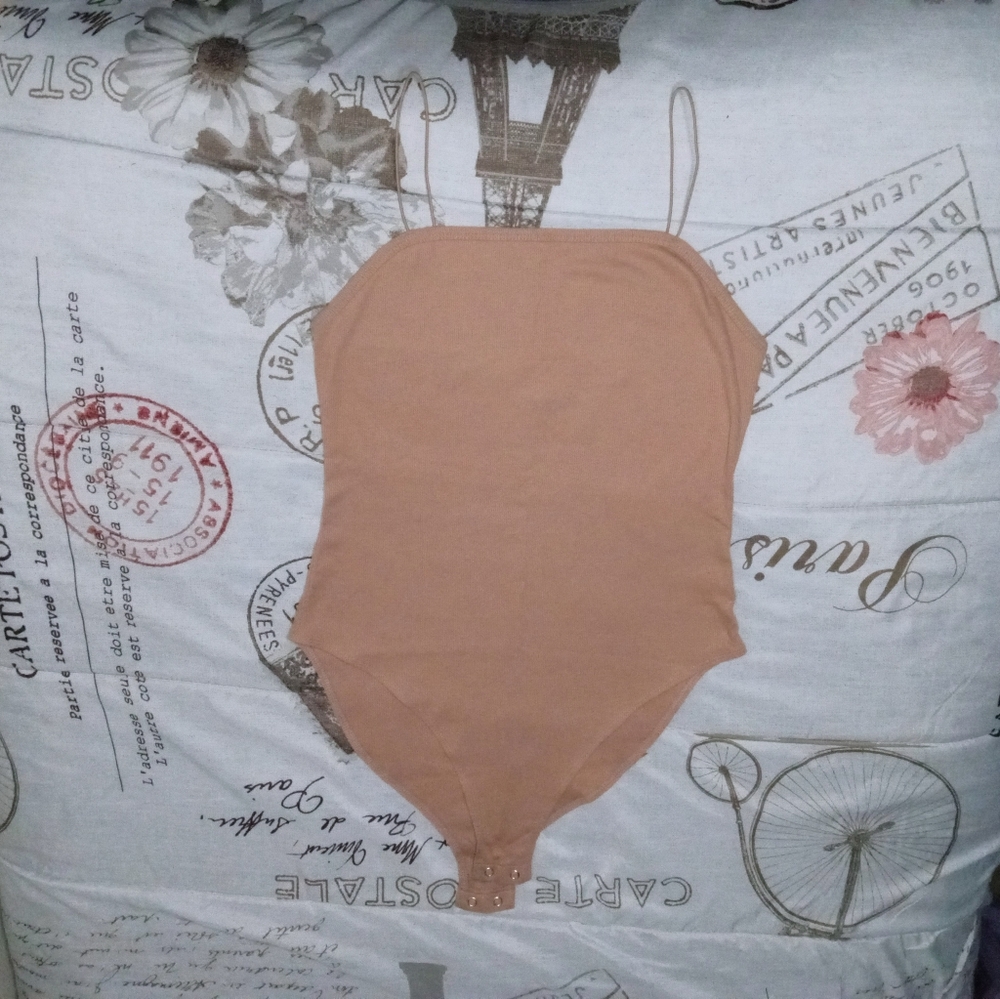 Bodysuit with a round top and spaghetti strap